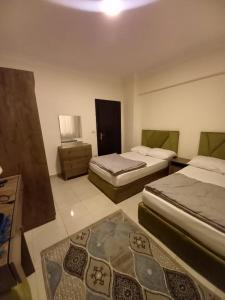 Ένα ή περισσότερα κρεβάτια σε δωμάτιο στο Smile Apartment