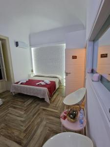 Posteľ alebo postele v izbe v ubytovaní Calypso Il Binario Elegance