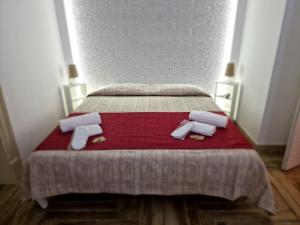 Posteľ alebo postele v izbe v ubytovaní Calypso Il Binario Elegance