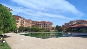 a large apartment complex with a pool of water at Magic Dreams Apart Complex, studio in Sveti Vlas
