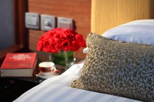Postel nebo postele na pokoji v ubytování Min Zu Hotel
