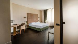 Postel nebo postele na pokoji v ubytování Hotel Cora