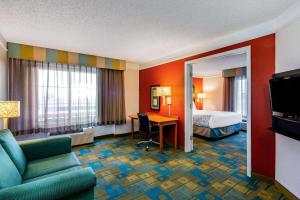 a hotel room with a bed and a desk at La Quinta by Wyndham Fremont / Silicon Valley in Fremont