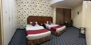 Postel nebo postele na pokoji v ubytování Al Zahabiya Hotel Apartments