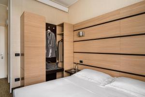 Postel nebo postele na pokoji v ubytování Hotel Cora