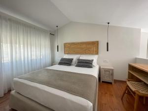 Posteľ alebo postele v izbe v ubytovaní Triantafilia Guesthouse