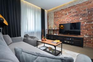 A television and/or entertainment centre at The Grey Apartment