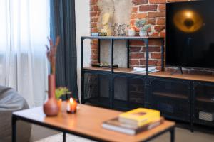 A television and/or entertainment centre at The Grey Apartment