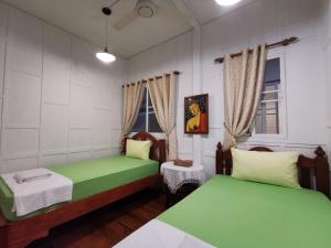 Postel nebo postele na pokoji v ubytování TAVEE Guesthouse
