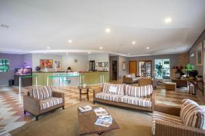 a large living room with couches and a table at Paraty Hotel Fazenda & Spa in Ibiúna