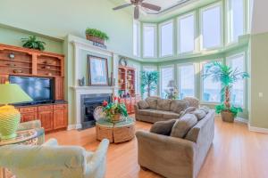 a living room filled with furniture and a flat screen tv at NTB104 Seas Escape in North Topsail Beach