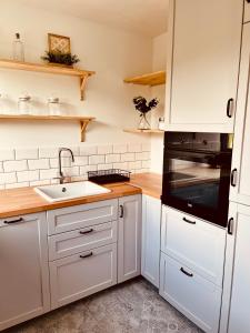 Kuchyňa alebo kuchynka v ubytovaní Apartament u Agnieszki