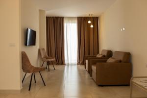 TV a/nebo společenská místnost v ubytování Fllad Resort & SPA Durres