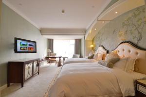 a hotel room with two beds and a wall mural at Urban Island Hotel Shanghai in Jiading