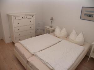 Postel nebo postele na pokoji v ubytování Haus Nordseeresidenz Wohnung 09