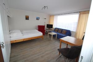 Postel nebo postele na pokoji v ubytování Haus Nordseeresidenz Wohnung 94