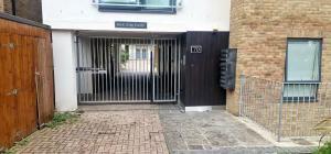 an entrance to a building with a black door at Charlotte Double Room in London