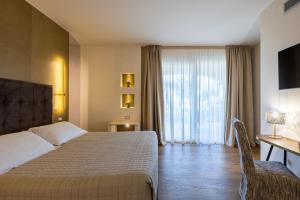 Кровать или кровати в номере Relais Masseria Caselli