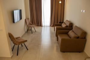 TV a/nebo společenská místnost v ubytování Fllad Resort & SPA Durres