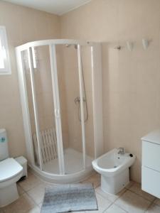a bathroom with a shower and a toilet and a sink at Casa Nube in Sant Francesc Xavier +22 photos