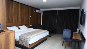 Voodi või voodid majutusasutuse Aventus Hotel toas