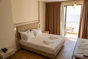 Postel nebo postele na pokoji v ubytování Fllad Resort & SPA Durres