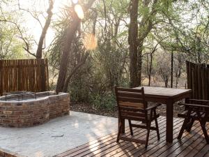 En terrasse eller udendørsområde på Cottage@Injabulo