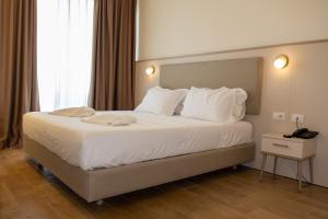 Postel nebo postele na pokoji v ubytování Fllad Resort & SPA Durres