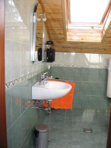 a bathroom with a sink and a mirror at Apartments Janči, Murter (Croatia) in Murter