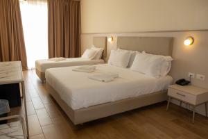 Postel nebo postele na pokoji v ubytování Fllad Resort & SPA Durres