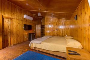 a bedroom with a bed in a wooden wall at Safari Beach Nuweiba in Nuweiba +125 photos