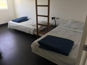 Cama o camas de una habitación en Casa de Playa en Condominio Albatros - Bujama