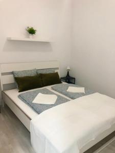 a white bed with two pillows on it in a room at Chayofa Hills - 2 Bedroom Apartment with Ocean Views and Air-condition A in Chayofa