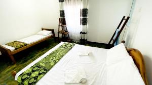 Postel nebo postele na pokoji v ubytování Madiha Surf House Lanka