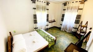Postel nebo postele na pokoji v ubytování Madiha Surf House Lanka