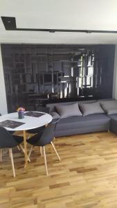 a living room with a couch and a table at Słoneczny in Kielce