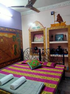 two beds in a room with two beds sidx sidx sidx at Golden Dreams Guest House in Jodhpur