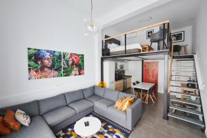 a living room with a couch and a bunk bed at Artist's Loft in the centre of Santa Cruz in Santa Cruz de Tenerife