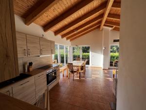 a kitchen with a table and a dining room at Fichtel in Graal-Müritz