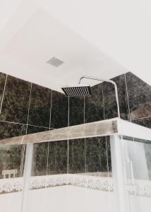 a shower with a curtain in a bath room at Miriam Costa de la luz 2 in Jerez de la Frontera