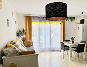 a living room with a couch and a table at Welcome to Hakuna matata ! in Chanteloup-en-Brie