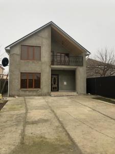a house with a large driveway in front of it at Qusar House in Qusar