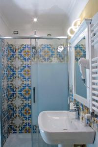 a bathroom with a sink and a shower at Olimpo degli Dei in Naples +159 photos