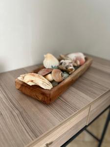 a tray of different types of mushrooms on a table at kochyli studios in Asprovalta +5 photos