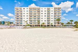 a view of the hotel from the beach at Sea Breeze 401 in St Pete Beach