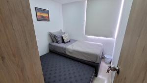 Postel nebo postele na pokoji v ubytování APARTAMENTO NUEVO AMOBLADO Neiva Conjunto Residencial Goya 504