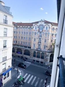 a view of a city street with a building at Le Voltaire apartment - Paris Center in Paris