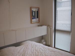 מיטה או מיטות בחדר ב-Design Apartment Pandreitje Brugge