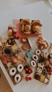 a table with many different types of food on it at B&B Biesvenhof in Merksplas