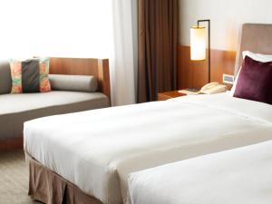 Letto o letti in una camera di Silks Place Yilan